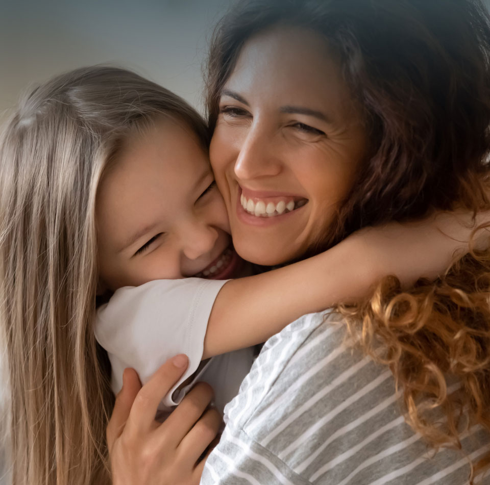 mishawaka mommy makeover model and child embracing