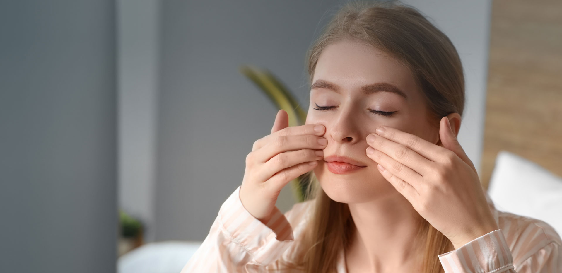 skincare model in mishwaka rubs her face