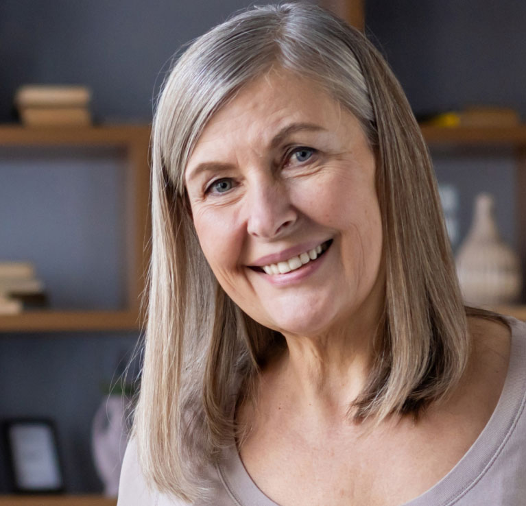 smiling woman modeling post hair growth treatment results