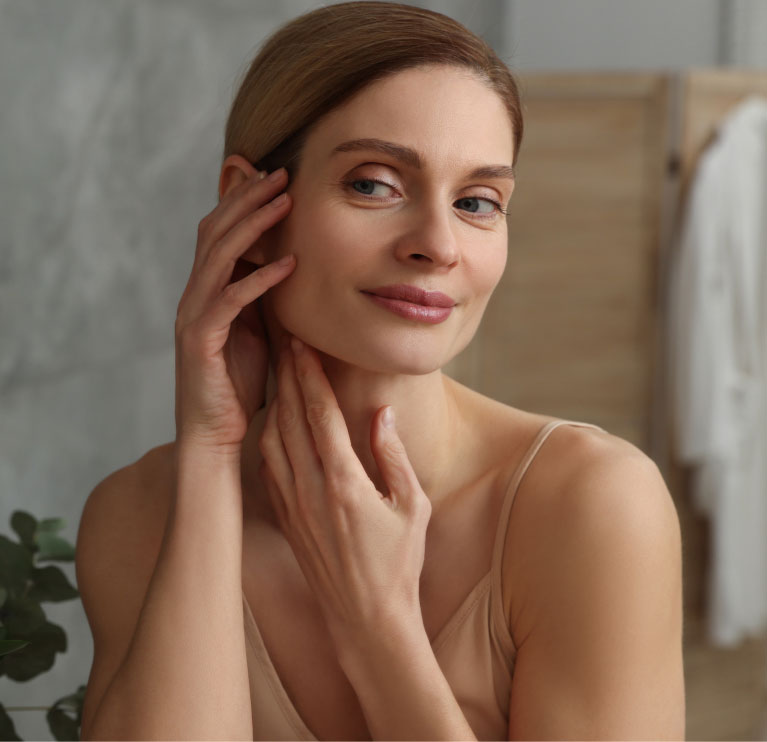 woman framing chin with hands woman framing chin with hands